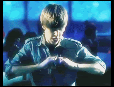 justin bieber heart sign. cute with his peace sign